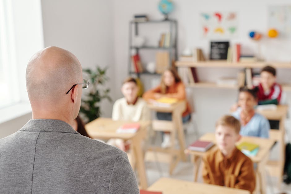 Teacher leading a classroom discussion with attentive students